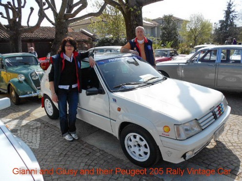 Giusy and Gianni with their Peugeot 205 GTI vintage car